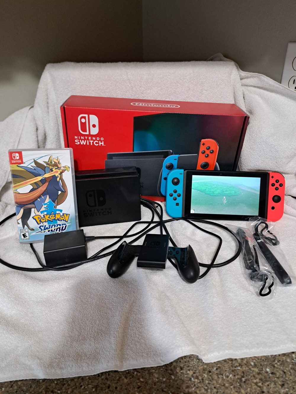 Nintendo Switch with Neon Blue & Neon Red Joy‑Con and Pokémon Sword